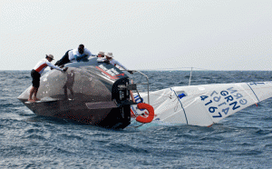 J/24 Island Water World Die Hard crew struggle to right the boat